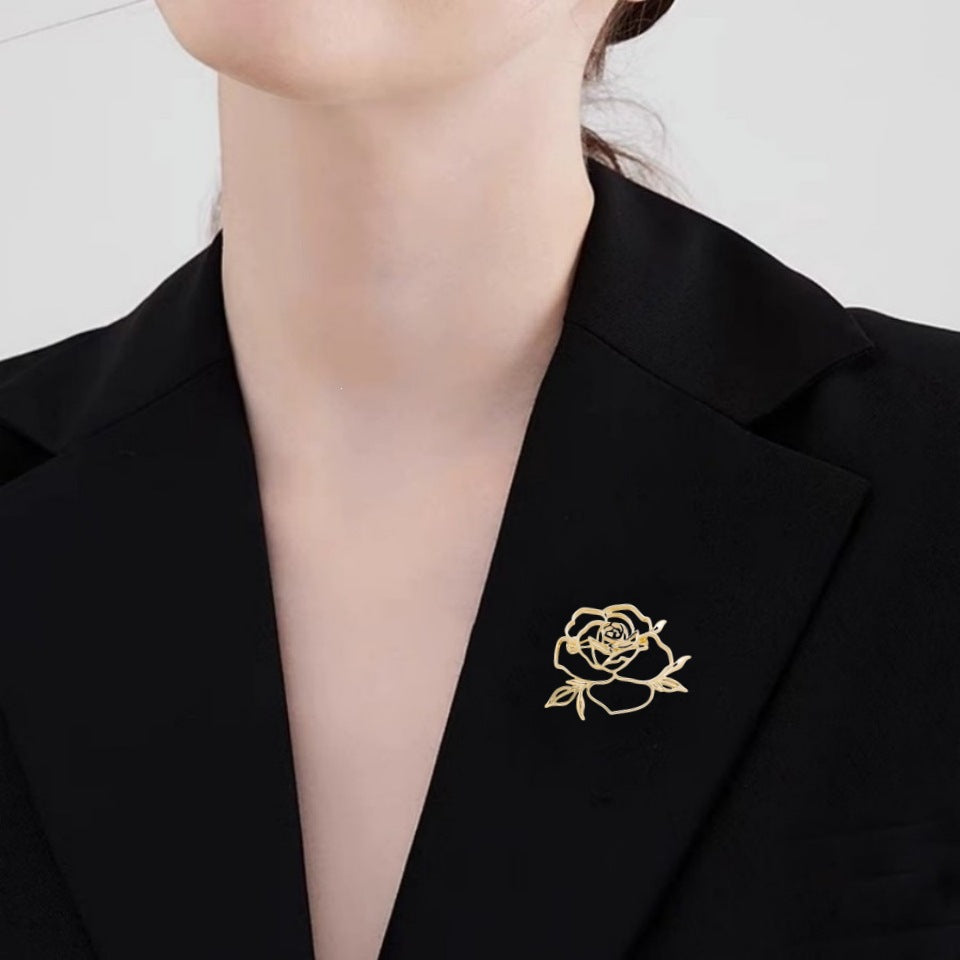 Gold-tone rose flower brooch with intricate petals, stylish women's fashion pin.