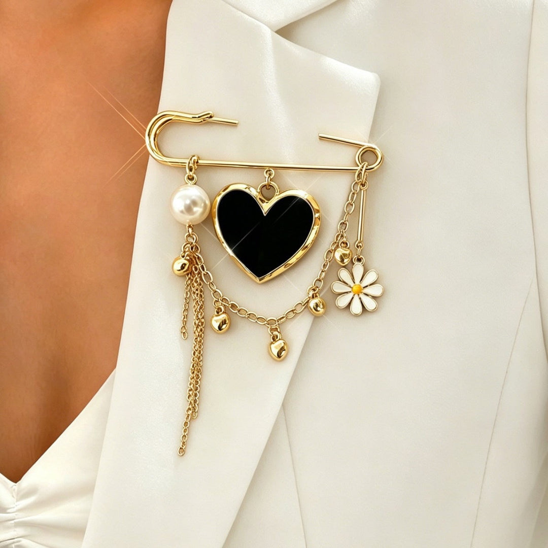 Close-up of a women's gold safety pin pendant necklace, showcasing its unique and elegant charm.