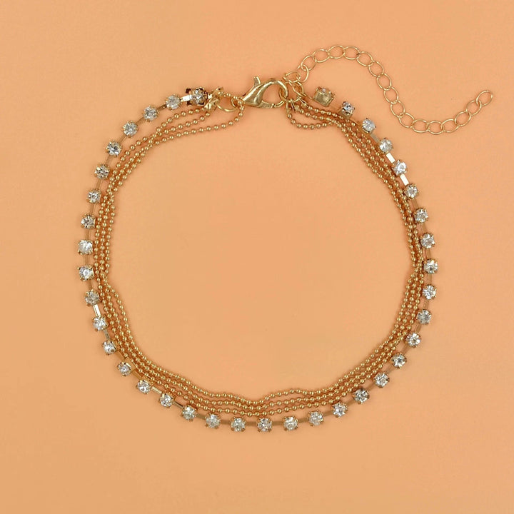 Fashionable women's double layer anklet. Elegant gold-tone foot chain jewelry for any occasion.