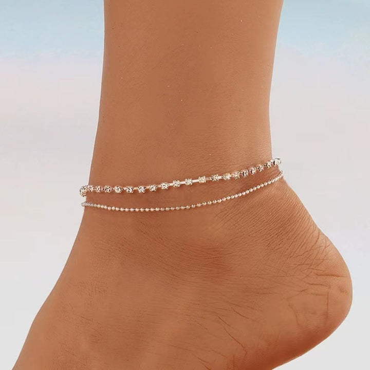 Women's elegant layered anklet. Delicate gold-tone foot chain, perfect for summer beach jewelry.