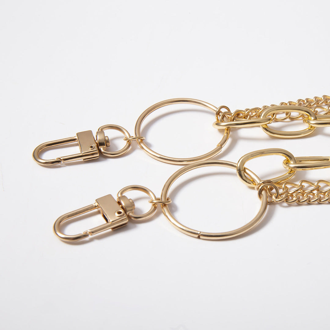 Chic gold layered body chain, a trendy unisex fashion accessory. Elevate your style with this versatile statement jewelry.