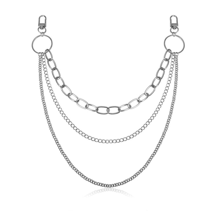 Intricate layered body chain, a versatile unisex fashion accessory. Elegant gold-tone jewelry creating a unique silhouette.