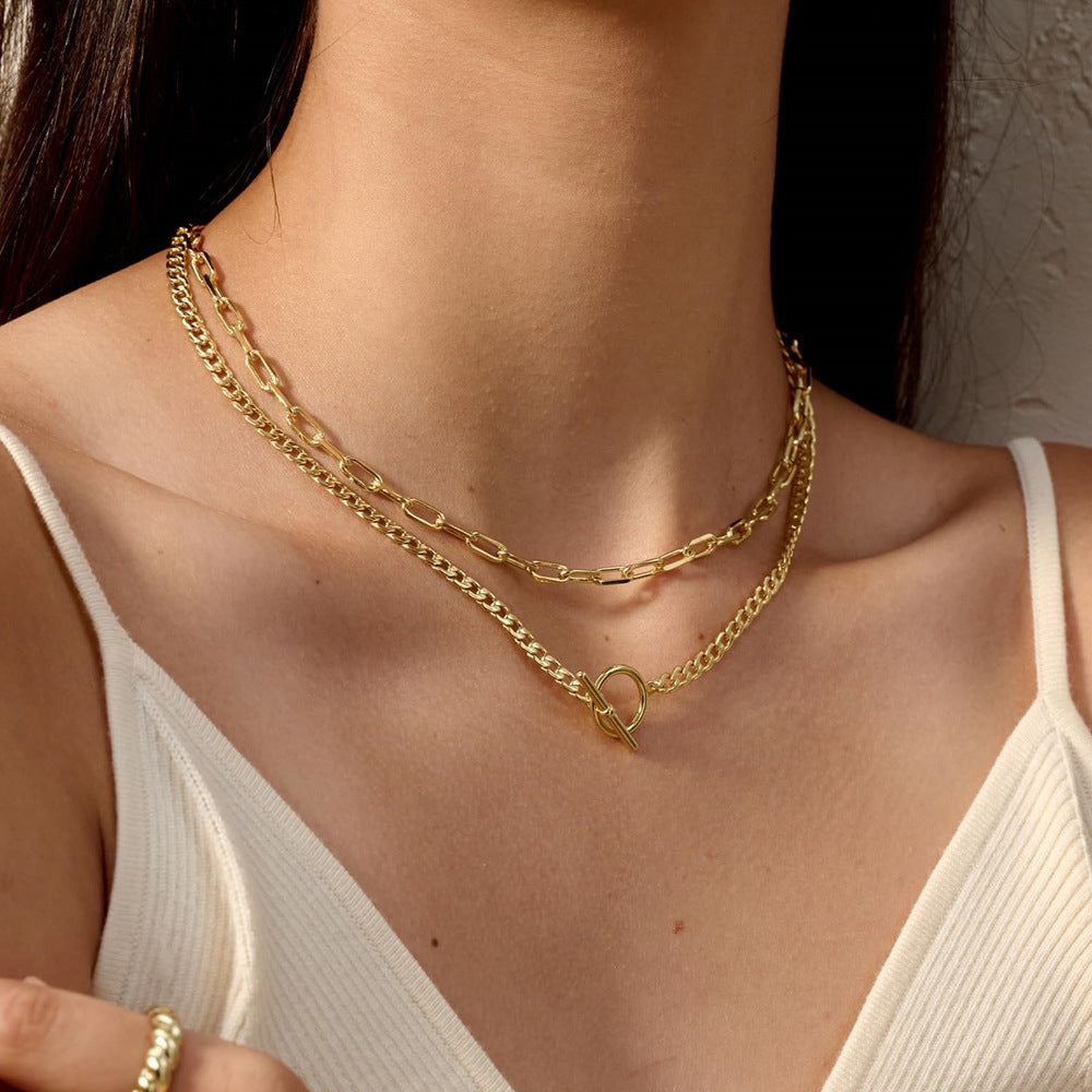 Stylish multi-layered gold chain necklace for women, an elegant statement accessory.