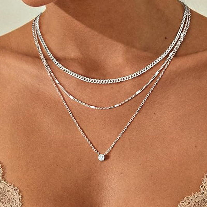 Chic women's gold-finish multi-layered chain necklace. Perfect statement jewelry & fashion accessory for any outfit.