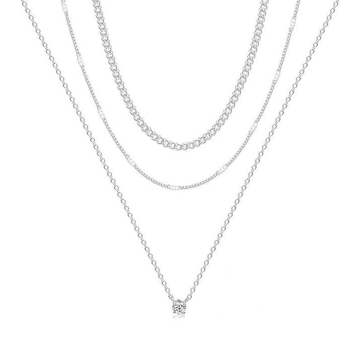 Sophisticated gold layered chain necklace for women. Versatile and elegant fashion accessory, a must-have jewelry piece.