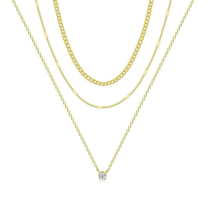 Modern multi-layered gold tone necklace for women. Elegant chain jewelry, perfect for a refined fashion statement.