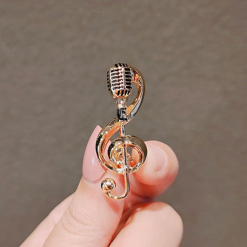 Detailed metal musical note brooch; a shiny, elegant unisex pin perfect for jackets & bags. Gift for musicians.