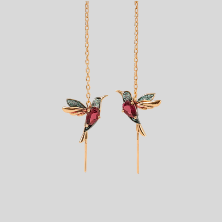 Elegant gold-tone women's hummingbird drop earrings with shimmering crystal accents. Perfect whimsical jewelry gift.