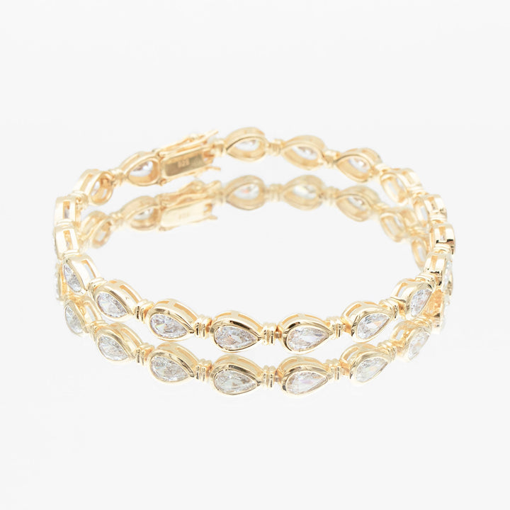 Elegant women's gold vermeil padel bracelet, sterling silver, delicate pear stone accent, luxury everyday jewelry.
