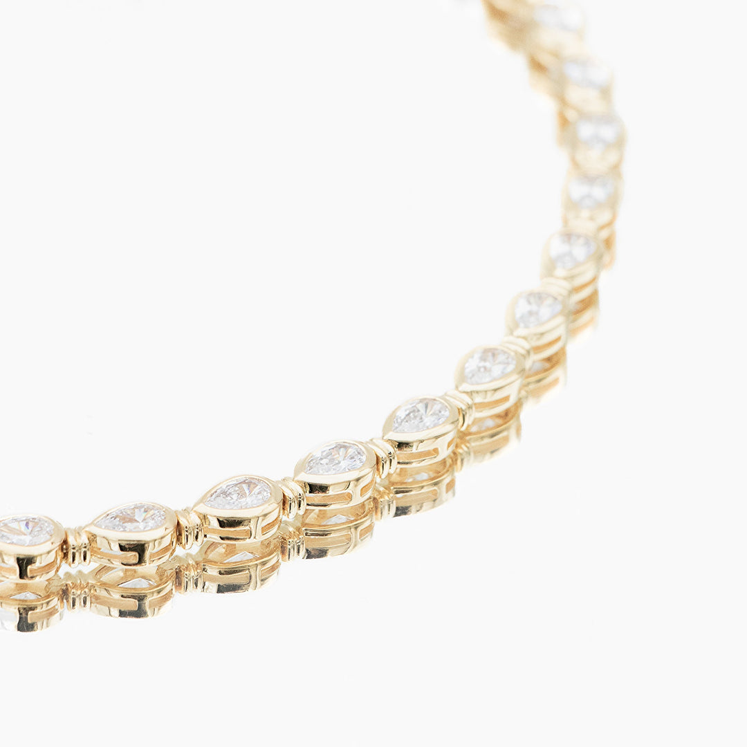 Timeless women's padel bracelet: delicate gold vermeil & sterling silver, pear stone detail, stackable luxury.