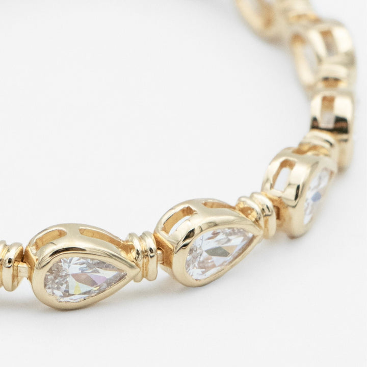 Delicate pear stone padel bracelet for women, crafted in elegant gold vermeil & sterling silver, timeless luxury.