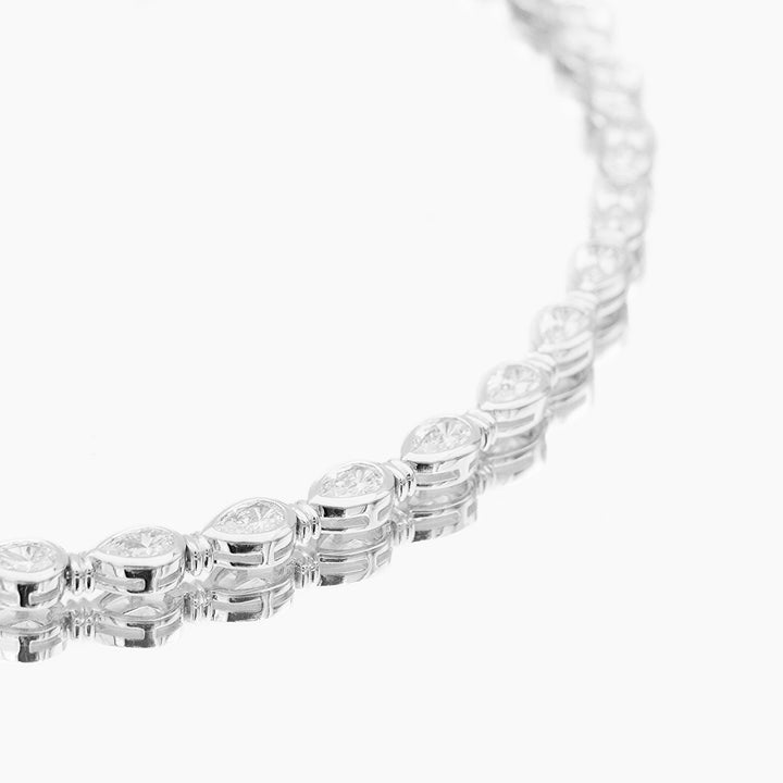 Delicate gold vermeil & sterling silver women's padel bracelet, luxury jewelry with an elegant pear stone.