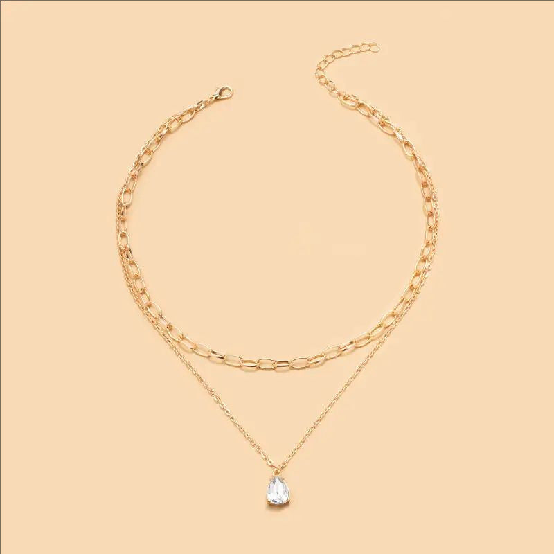 Fashionable women's gold & white layered necklace, a chic statement piece for any occasion.