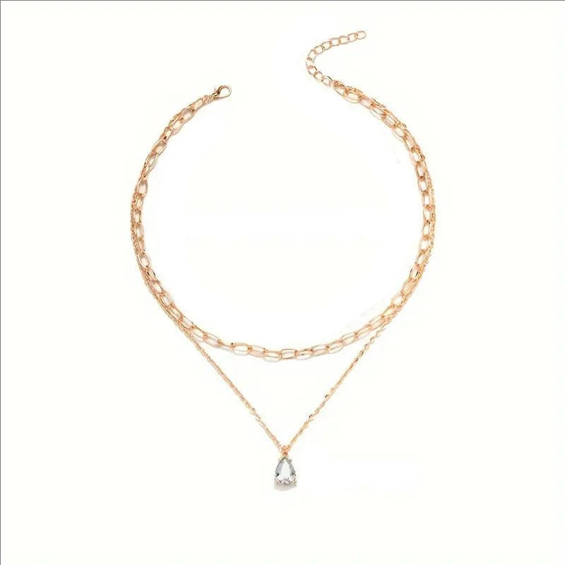 Versatile women's elegant layered link necklace, gold & white, perfect for daily wear or events.