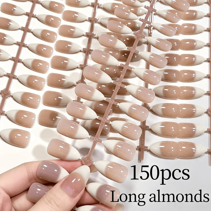 Artificial nails: Gradient French tip press-ons for an elegant women's beauty look.