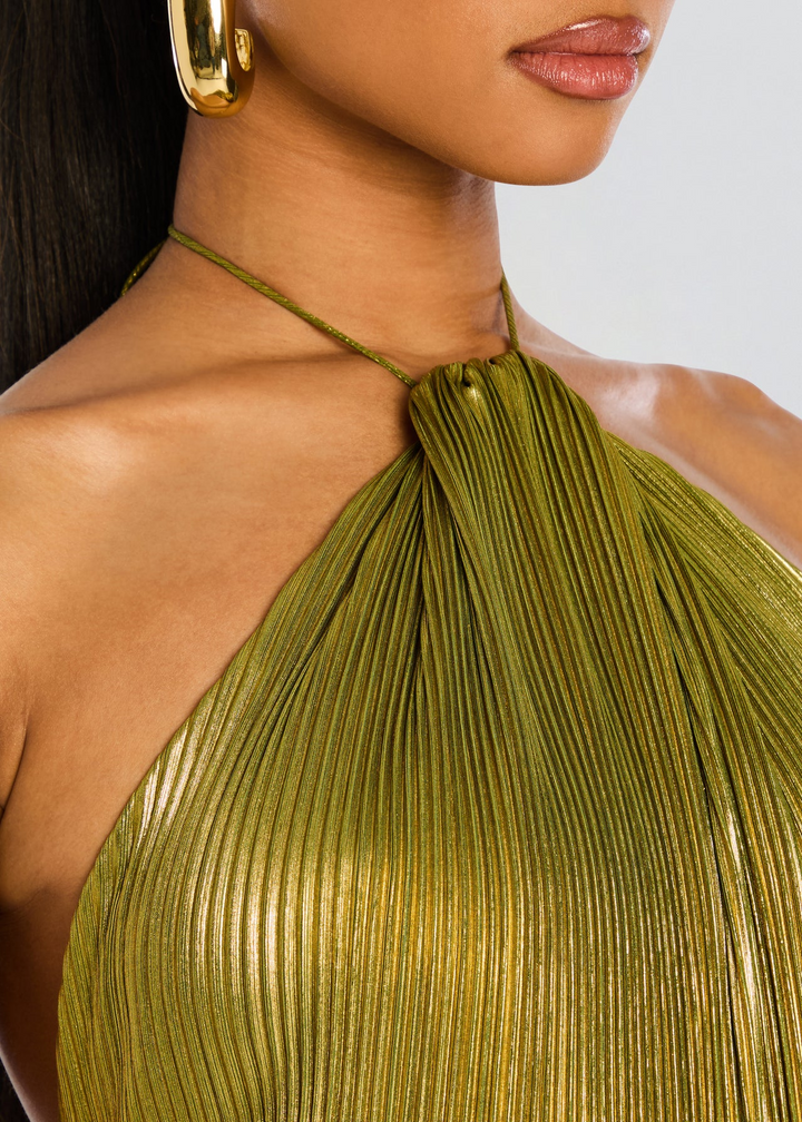 Women's sophisticated green halter neck maxi dress. Elegant formal wear with a flattering thigh split design.