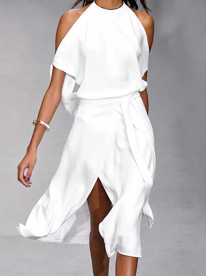 White asymmetric midi dress for women with an elegant open shoulder and adjustable tie waist for a flattering summer look.