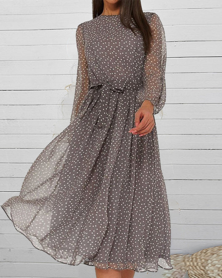 Comfortable women's grey polka dot A-line dress, knee-length, featuring long sleeves and an elegant casual style.