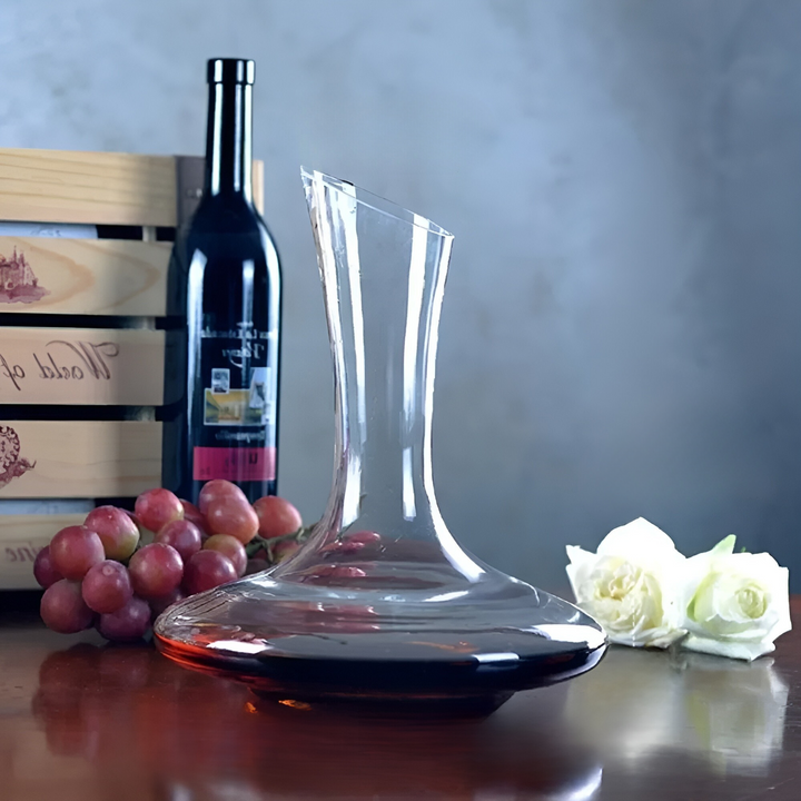 Elegant handmade crystal wine decanter with unique shape, perfect for enhancing wine aroma & barware collection.