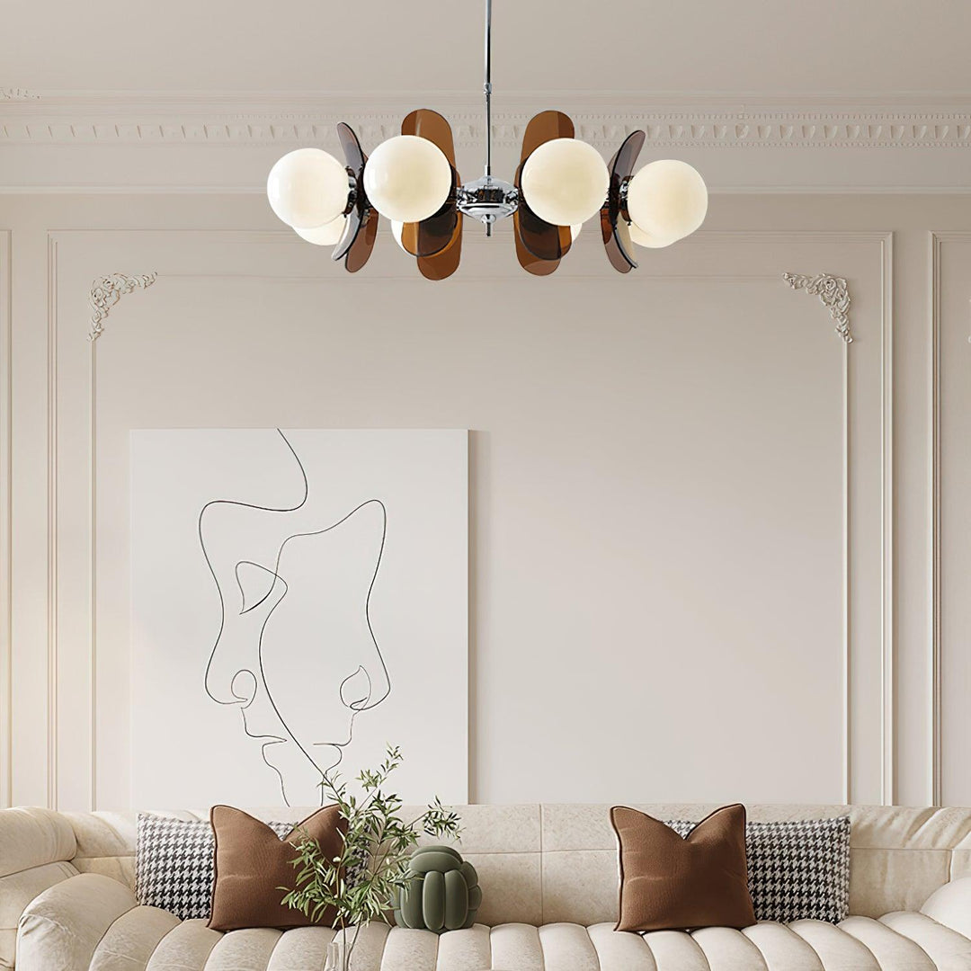 Stylish modern petal pendant light illuminating a dining area beautifully.