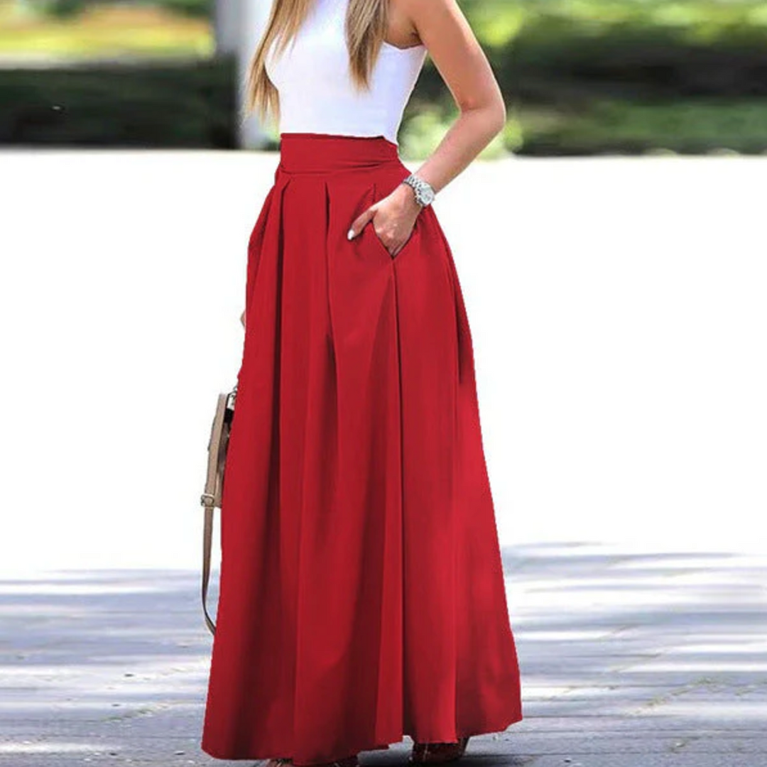 Elegant high-waist women's pleated maxi skirt, perfect for sophisticated summer fashion. Flowy long skirt for chic style.