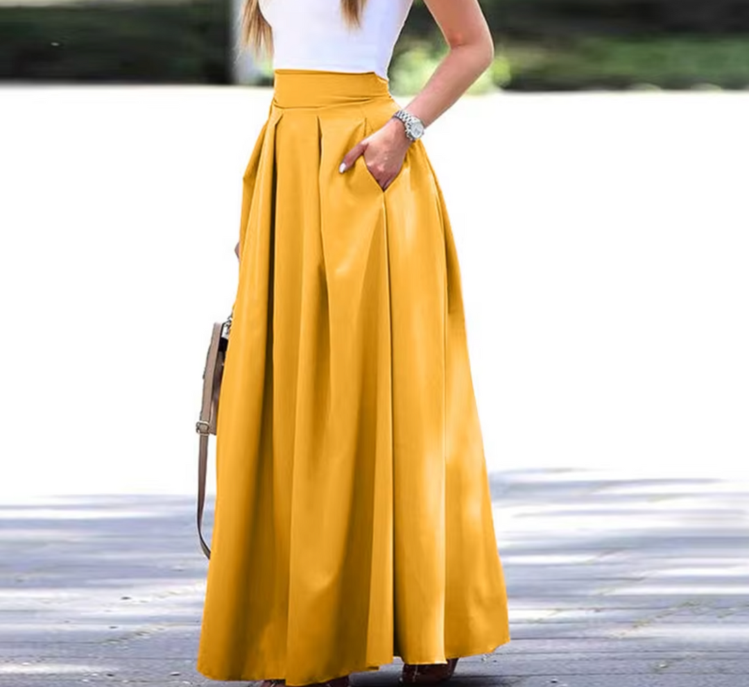 Stylish women's pleated maxi skirt, a must-have for elegant spring and summer fashion. Flowy long skirt with comfort.