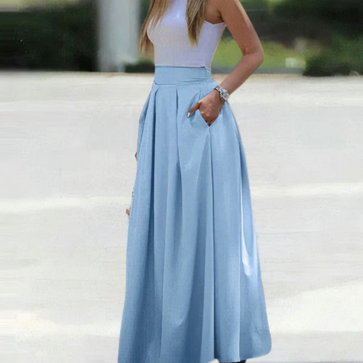 Beautiful women's high-waist pleated maxi skirt, long and flowy for effortless elegance & comfortable spring style.