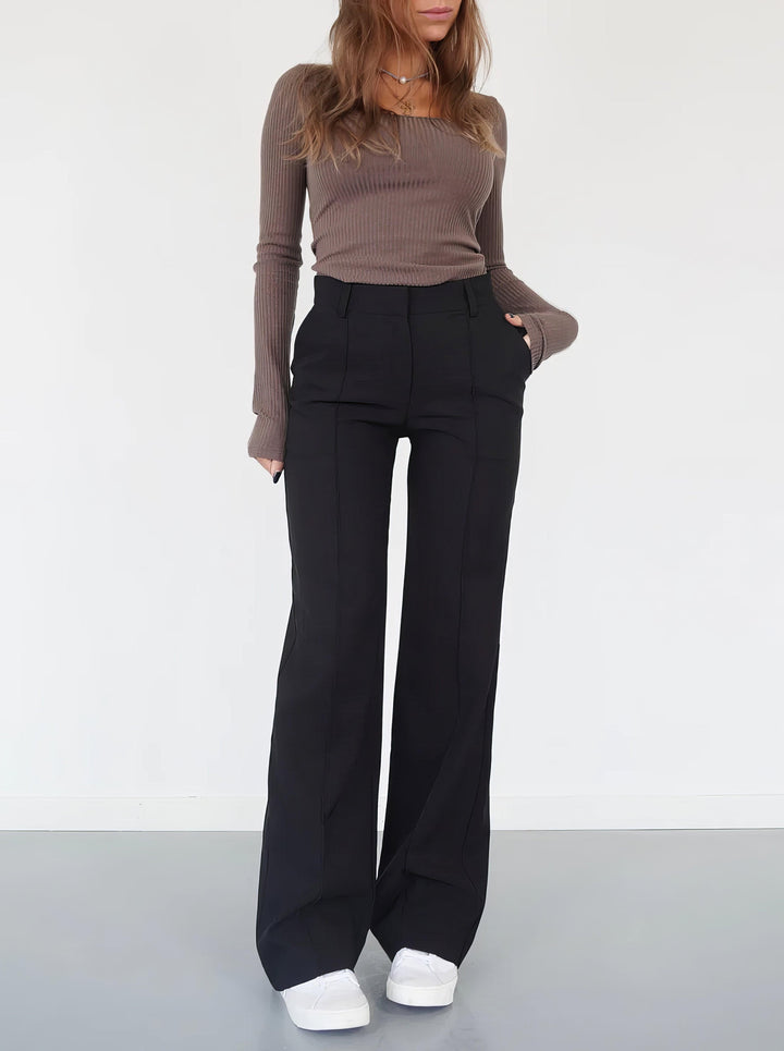 Elegant high-waisted wide-leg trousers for women, a modern fashion staple.