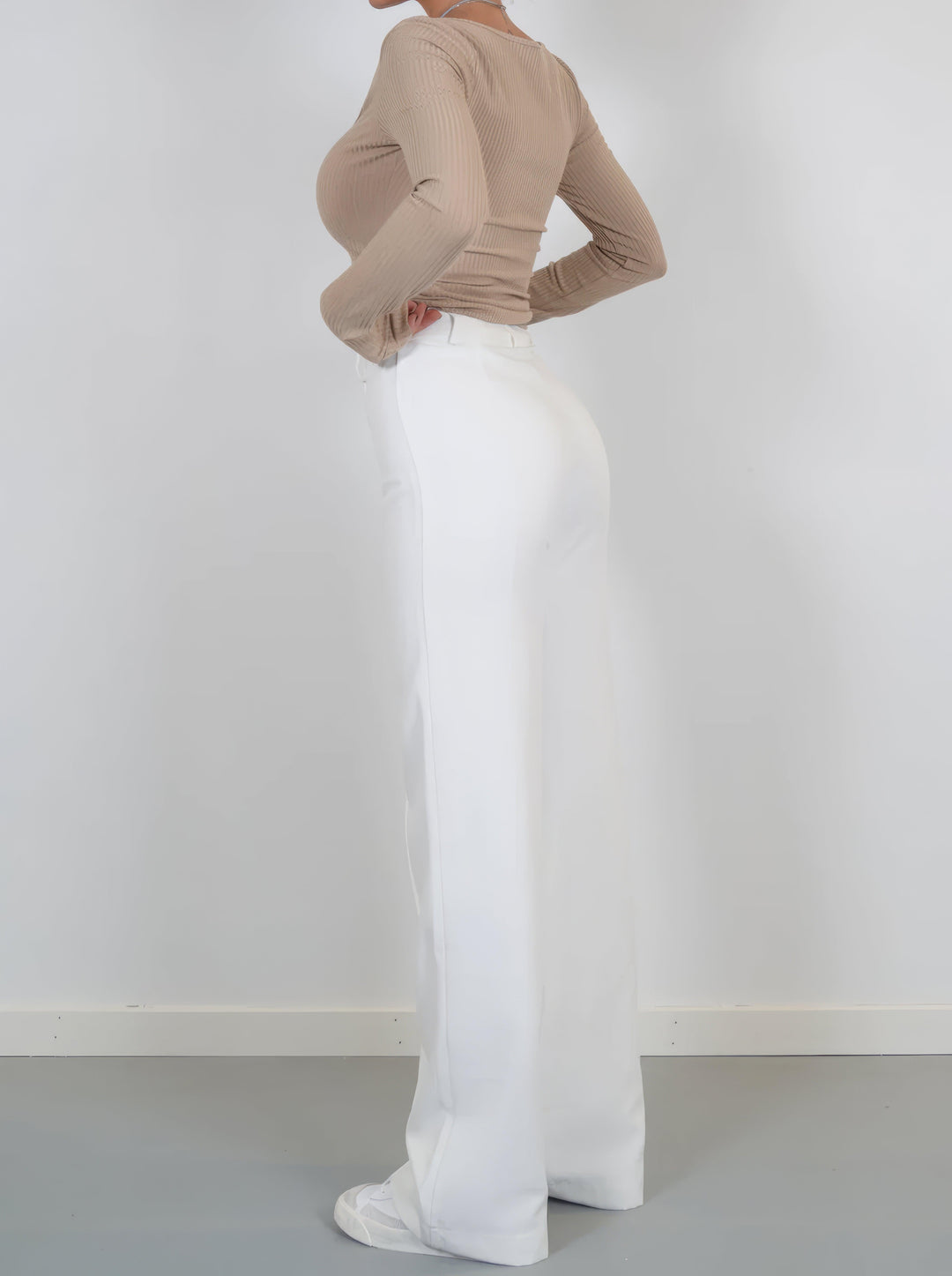 Navy elegant high-waisted wide-leg trousers, perfect for sophisticated women's outfits.