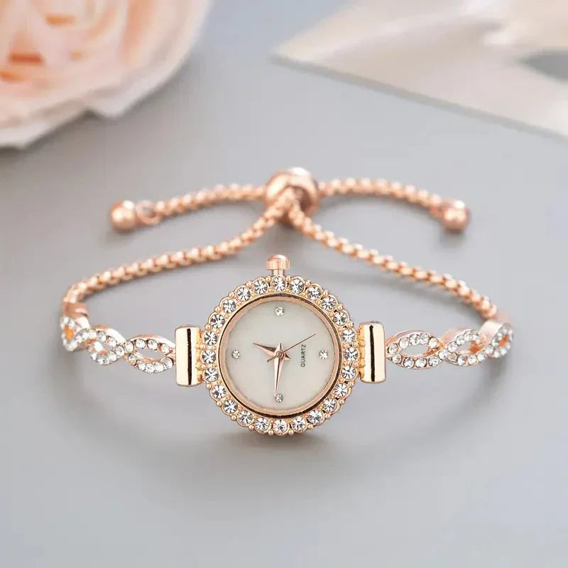 Elegant ladies' rose gold bracelet watch with dazzling crystal accents, perfect for luxury women's fashion.