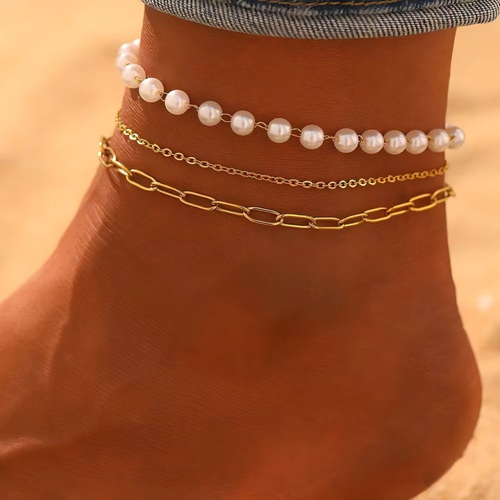 Elegant layered pearl and chain bracelet set for women. Fashionable adjustable jewelry, perfect gift for her.