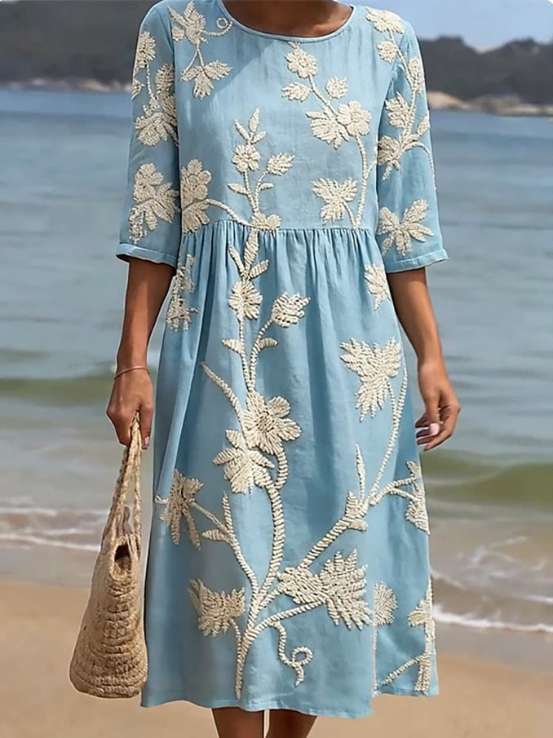 Relaxed fit light pink embroidered midi dress for women. Flowy, three-quarter sleeve, versatile spring/summer style.