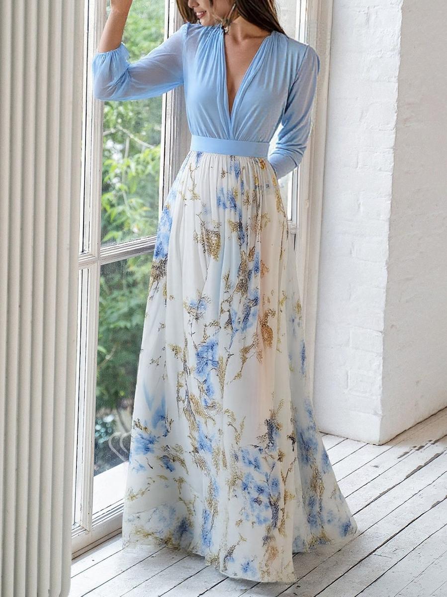 Women's elegant light blue printed flowing maxi dress, featuring a gathered bodice, ideal for special occasions.