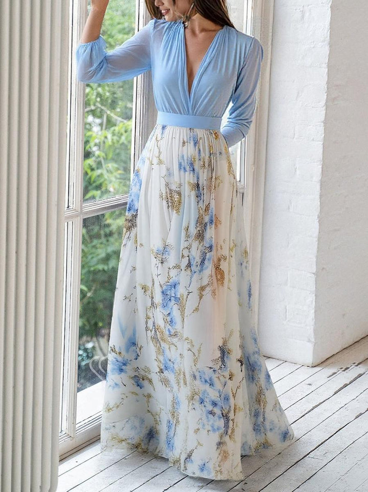 Women's elegant light blue printed flowing maxi dress, featuring a gathered bodice, ideal for special occasions.