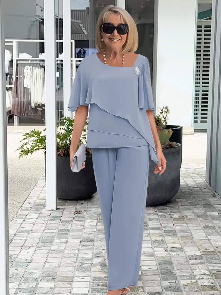 Elegant light blue women's summer two-piece skirt set for a chic, comfortable outfit. Feminine and versatile.