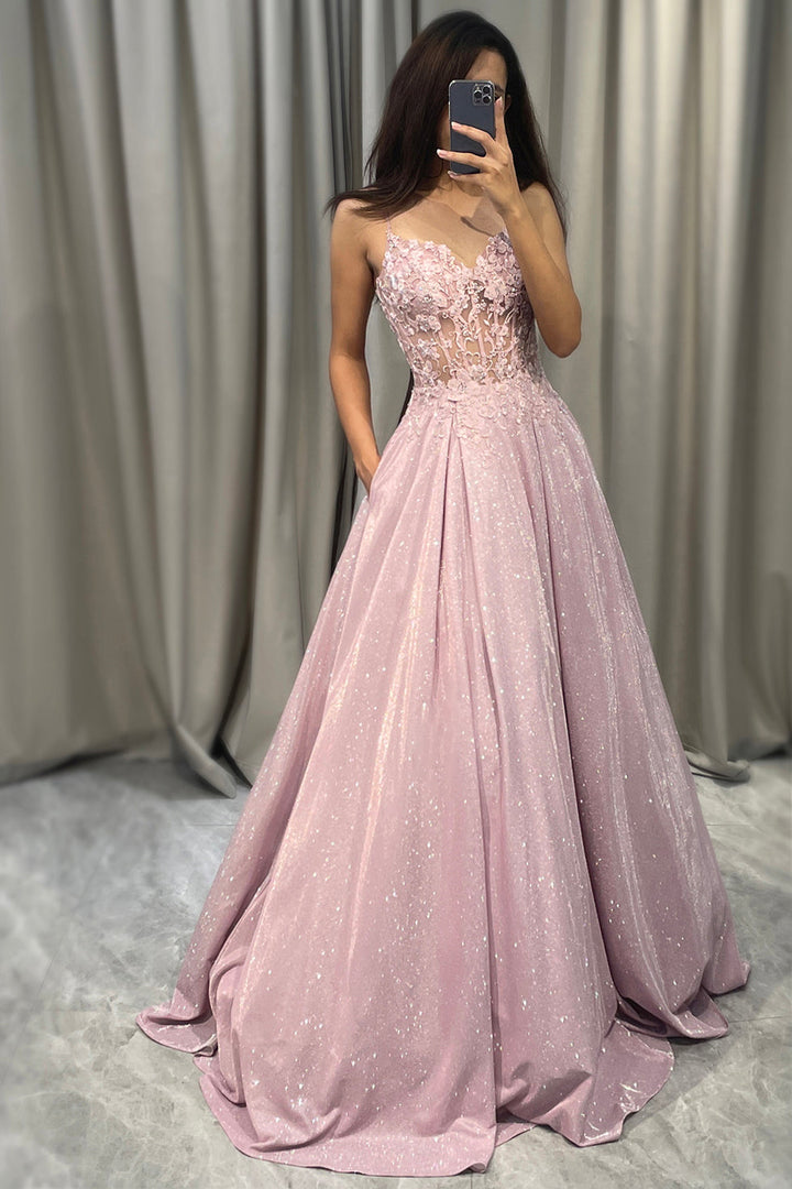 Elegant light pink women's embellished maxi dress, perfect for wedding guests or formal evening events. Sophisticated design.