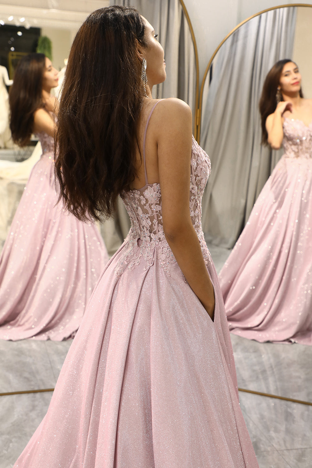 Close-up of intricate embellishments on a light pink maxi dress. Ideal for a sophisticated wedding guest outfit.