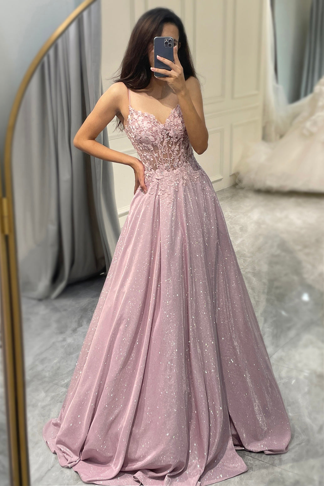 Back view of a stunning light pink embellished maxi dress for women. Elegant formal evening gown, perfect wedding guest attire.