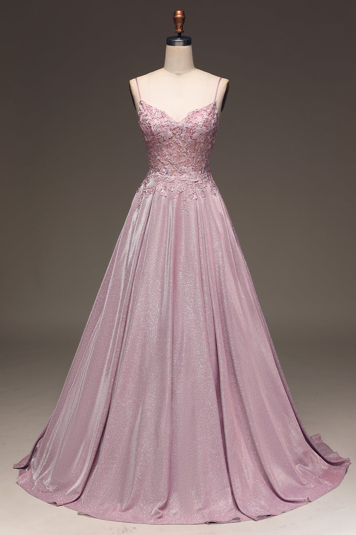 Luxurious fabric of a light pink embellished maxi dress, designed for sophisticated wedding guests and formal evening parties.