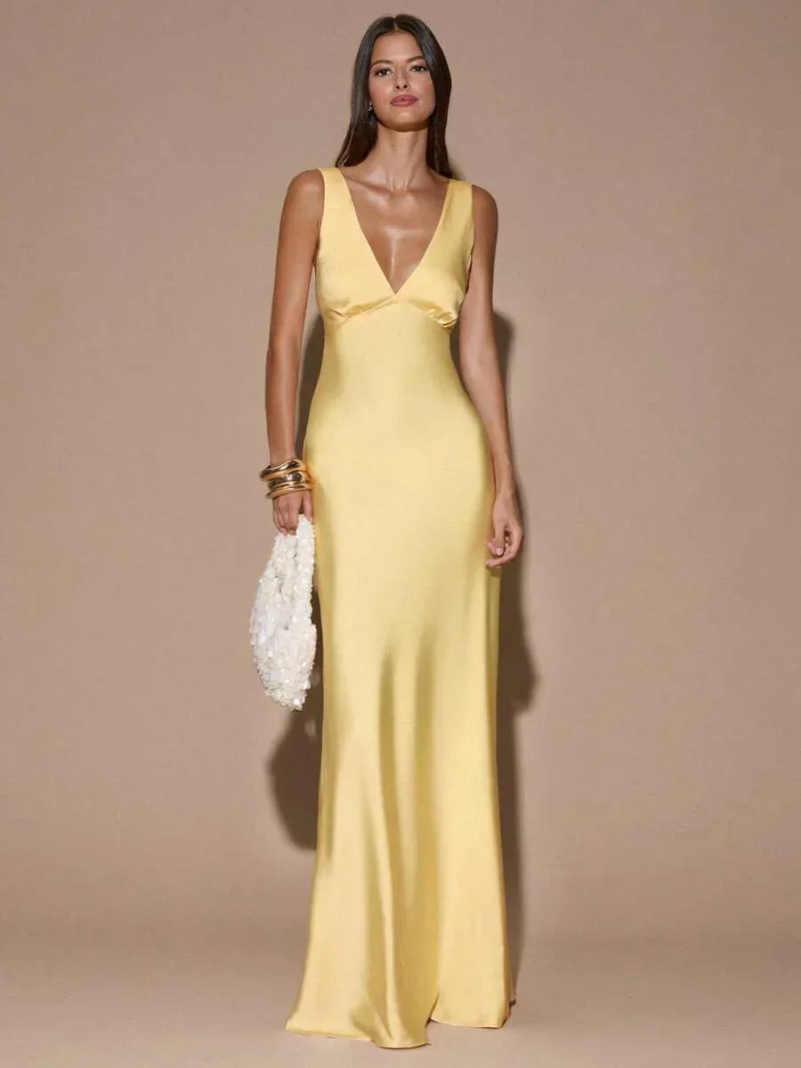 Stunning women's backless V-neck maxi dress in light yellow. Ideal elegant formal gown for parties & special events.