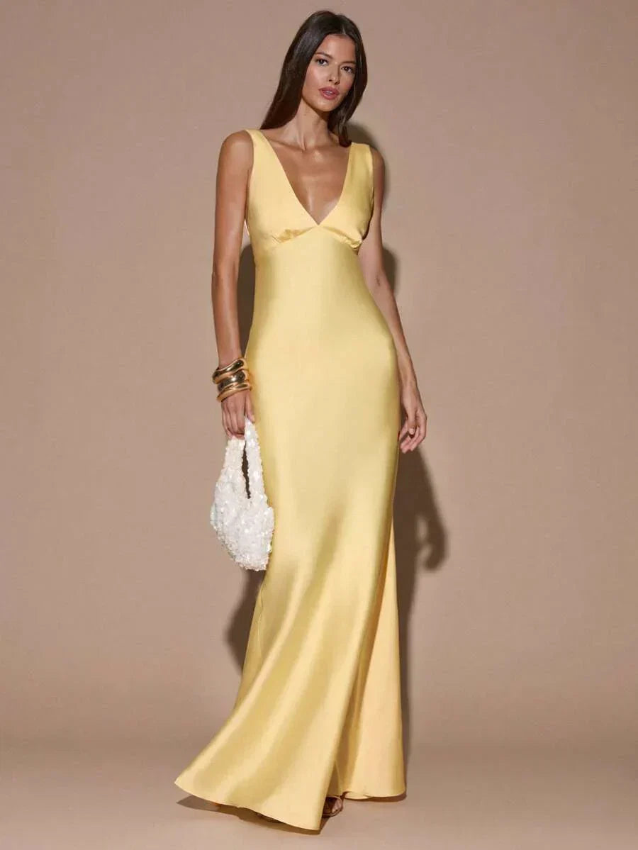 Chic light yellow V-neck formal gown for women. Elegant backless maxi dress perfect for wedding guests & evening parties.