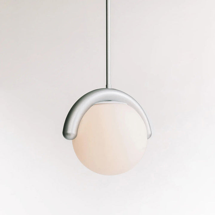 Contemporary linear chandelier, glass and metal construction for modern home decor.