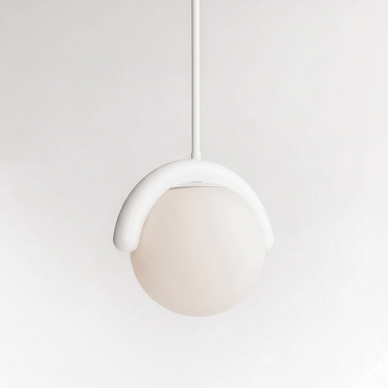 Modern linear pendant, sleek adjustable glass & metal light for living spaces.