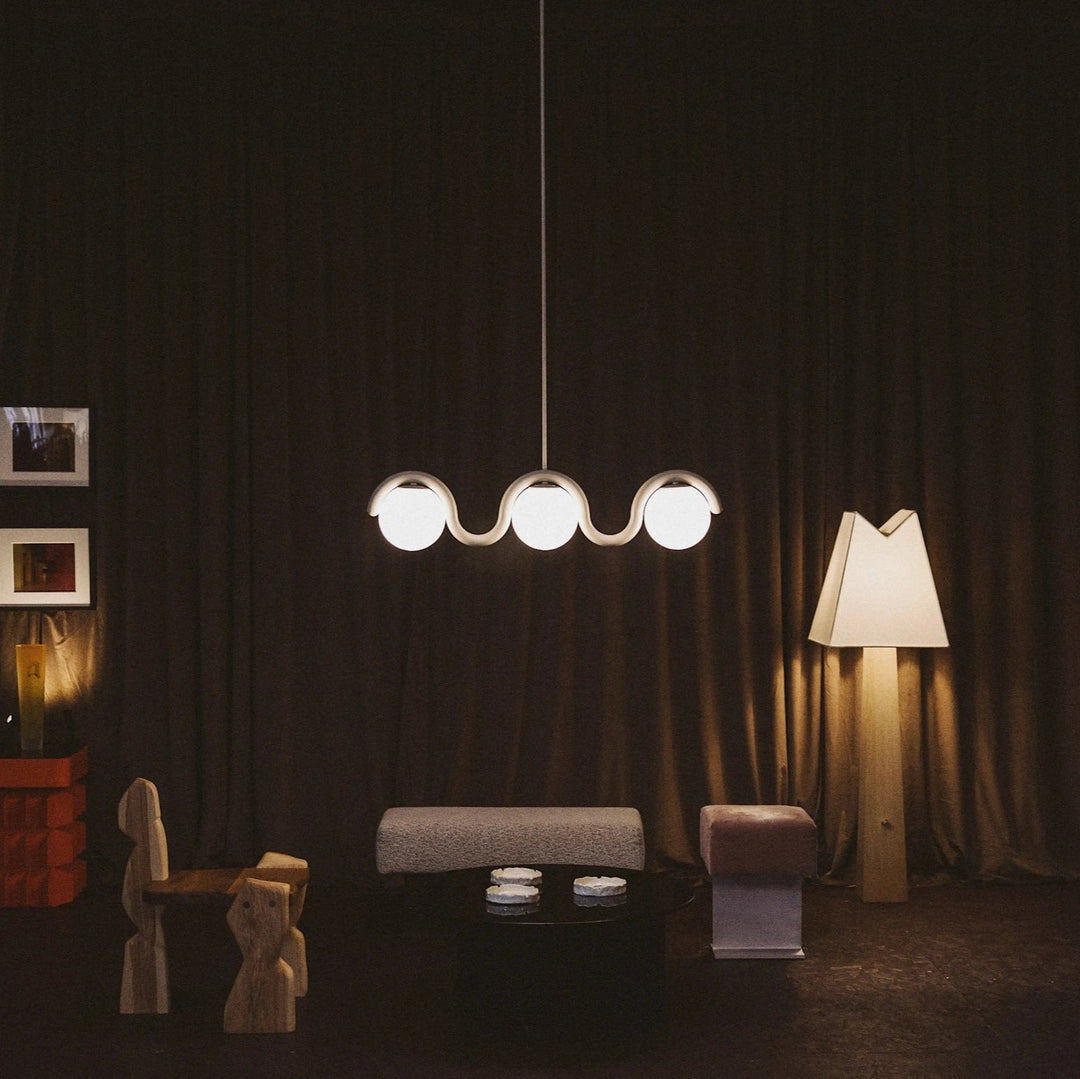 Contemporary linear chandelier, sophisticated glass & metal pendant for a living space.