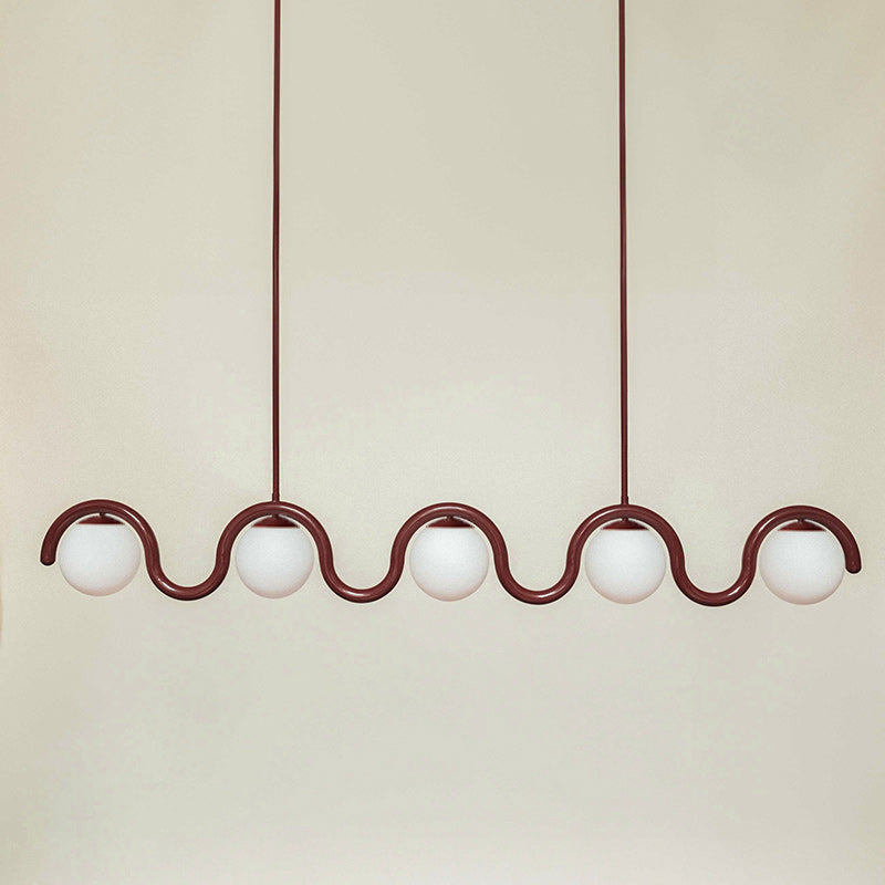 Sleek adjustable linear light, glass & metal pendant for contemporary living rooms.