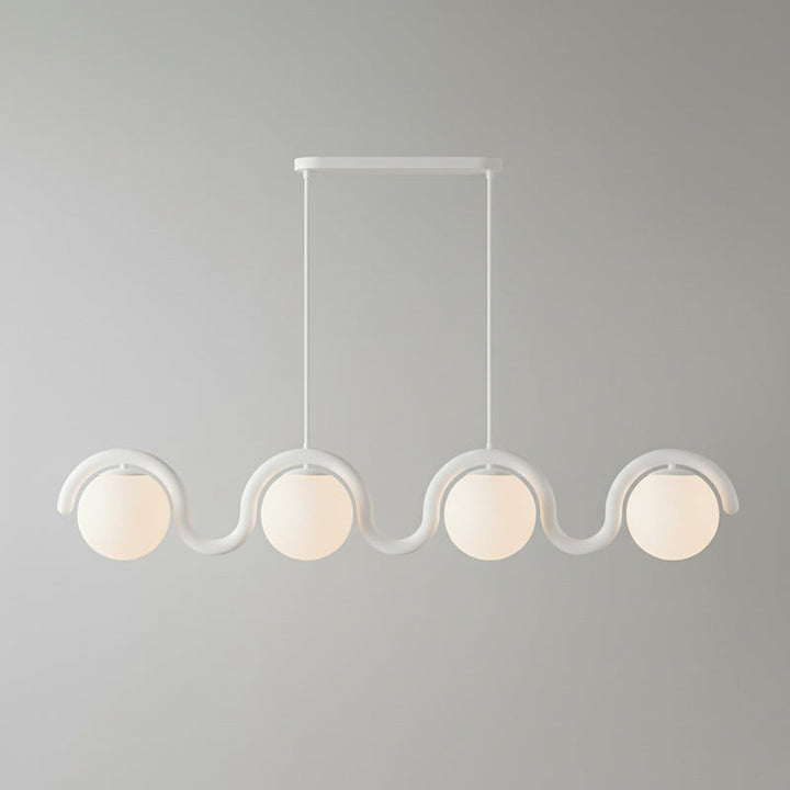 Modern linear pendant light, sophisticated glass and metal for stylish interiors.