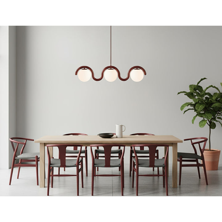 Modern linear pendant, stylish glass and metal for home decor.