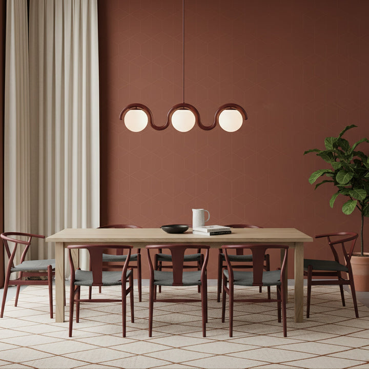 Stylish linear chandelier, glass & metal for modern dining room.