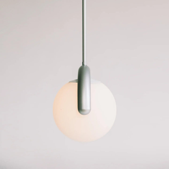 Sophisticated linear pendant light, metal & glass construction for modern living rooms.