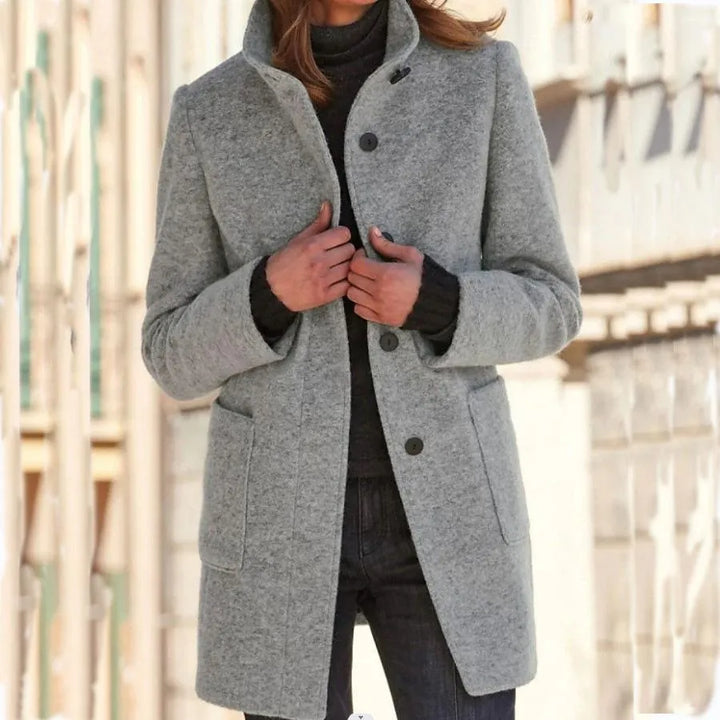 Women's stylish button-front long coat. Elegant & versatile outerwear for autumn, winter, and professional settings.